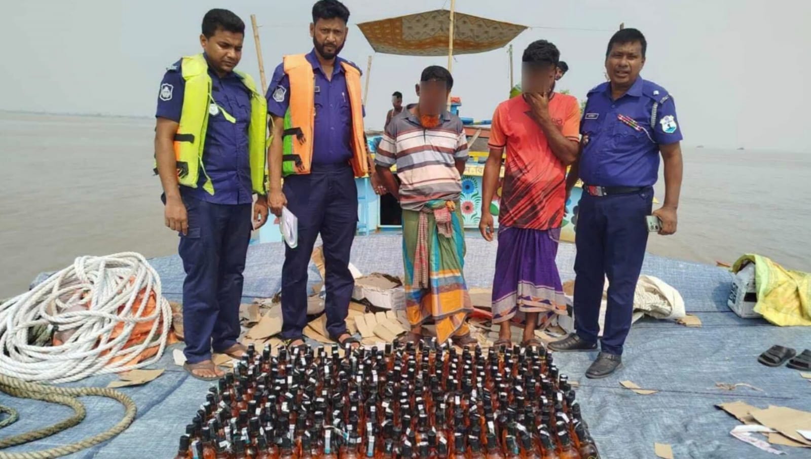 Two arrested with 305 bottles of Indian whisky and bulkhead seized from Padma river in Naria, Shariatpur