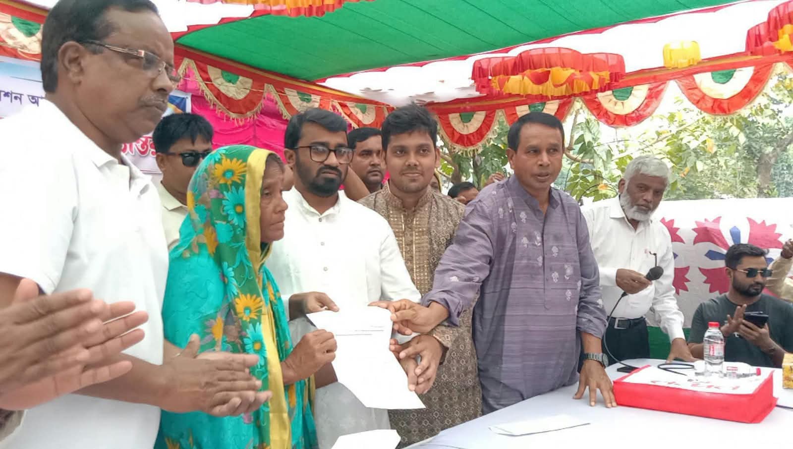 Appointment letter handed over to widely discussed destitute teacher Mission Acharya in Jhenaidah