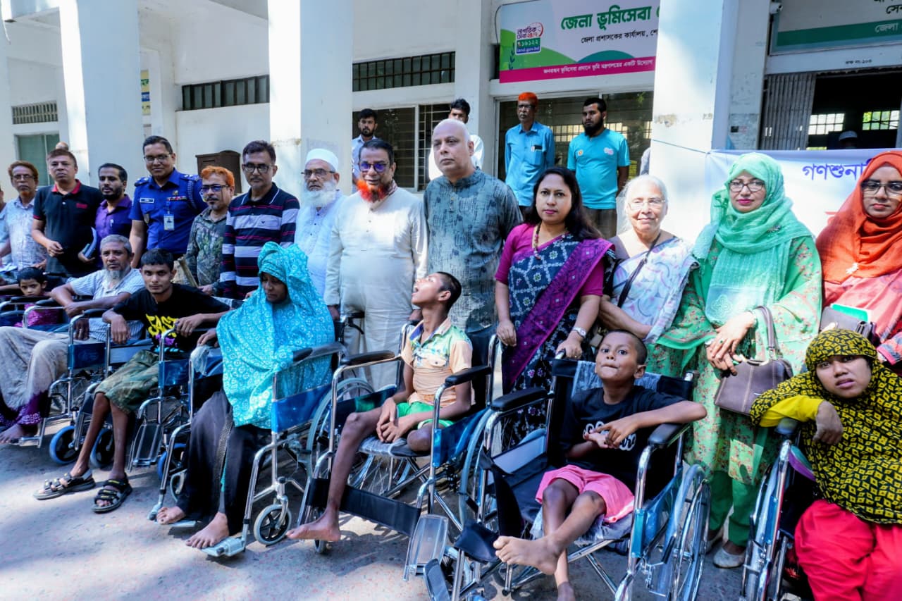 14 disabled individuals receive wheelchairs and call the Deputy Commissioner "Mother" in Sherpur