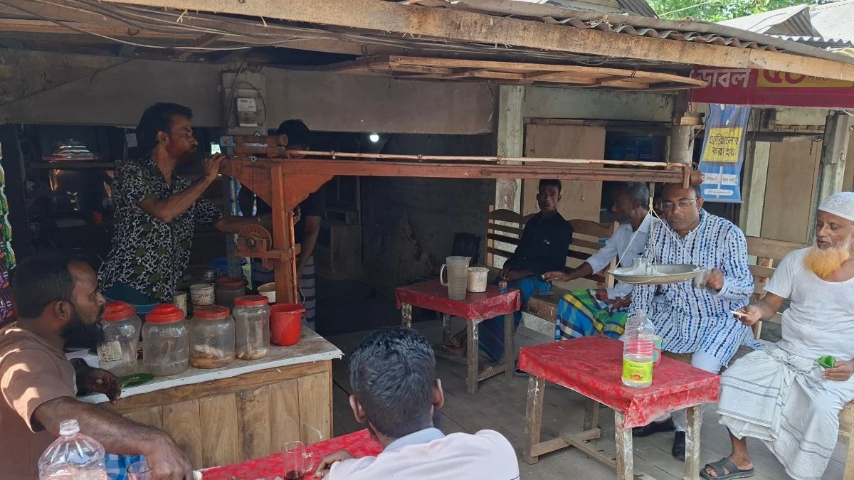 Hatem of Netrokona Serves Tea and Biscuits Using a 'Crane'